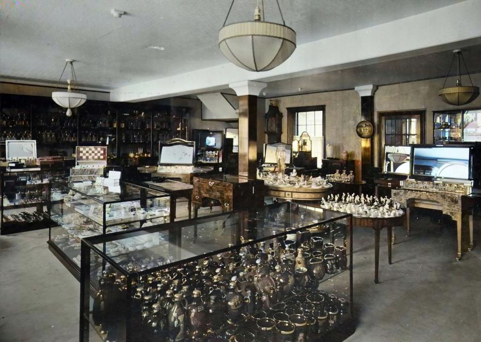 The interior of Harry Grant & Sons shop at 10 Strand. This remarkable picture from around 1900 shows  the huge range of products, many in white onyx  along with local pottery (colourised).